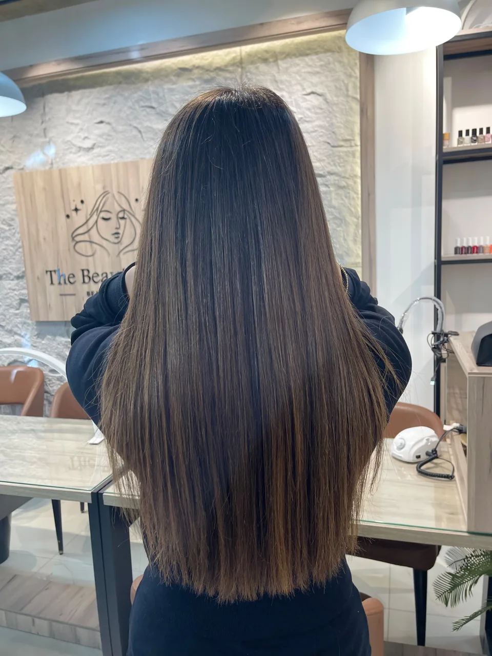 Long finished hairstyle inside The Beauty Spot by Samah